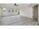 Large bedroom featuring light floors, recessed lights, a fan, and large windows at 177 Olympia Dr, Mooresville, NC 28117