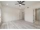 Spacious bedroom with light floors, a ceiling fan, and ample natural light at 177 Olympia Dr, Mooresville, NC 28117
