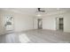 This primary bedroom features light floors, a tray ceiling, and access to closet and porch at 177 Olympia Dr, Mooresville, NC 28117