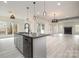Bright dining area with large windows offering natural light and an adjacent living area with fireplace at 177 Olympia Dr, Mooresville, NC 28117
