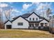 A modern farmhouse exterior with a front-facing garage and covered porch welcomes visitors at 177 Olympia Dr, Mooresville, NC 28117