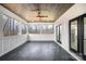 An enclosed porch boasts a wood ceiling and outdoor views at 177 Olympia Dr, Mooresville, NC 28117