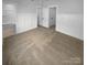 Spacious bedroom with carpet and en suite bathroom at 2124 Electric Ln, Charlotte, NC 28205