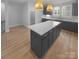 Modern kitchen with large island and dark cabinetry at 2124 Electric Ln, Charlotte, NC 28205