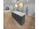 Modern kitchen with large island and light wood floors at 2124 Electric Ln, Charlotte, NC 28205