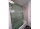 Updated bathroom with a large glass shower and modern bathtub at 2334 Woodleaf Dr, Gastonia, NC 28052