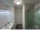 Updated bathroom with a glass enclosed shower and modern vanity at 2334 Woodleaf Dr, Gastonia, NC 28052