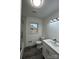 Updated bathroom with a modern vanity and shower/tub combo at 2334 Woodleaf Dr, Gastonia, NC 28052