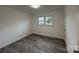 Bright bedroom with wood-look flooring and neutral walls at 2334 Woodleaf Dr, Gastonia, NC 28052