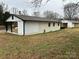 Side view of the home showcasing covered carport at 2334 Woodleaf Dr, Gastonia, NC 28052