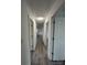 Long hallway with light gray wood-look flooring at 2334 Woodleaf Dr, Gastonia, NC 28052