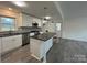 Modern kitchen featuring white cabinets, an island, and stainless steel appliances at 2334 Woodleaf Dr, Gastonia, NC 28052