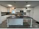 Modern kitchen featuring white cabinets, an island, and stainless steel appliances at 2334 Woodleaf Dr, Gastonia, NC 28052