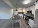 Open concept kitchen with island and stainless steel appliances at 2334 Woodleaf Dr, Gastonia, NC 28052