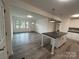 Bright and airy living room with hardwood floors and kitchen view at 2334 Woodleaf Dr, Gastonia, NC 28052