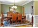 Formal dining room with elegant chandelier, hardwood floors, and classic décor at 2608 Golden Bell Dr, Gastonia, NC 28056