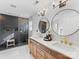 Elegant bathroom with double vanity, hexagon tile shower, and gold fixtures at 278 Corona Cir, Mooresville, NC 28117