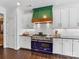 Stylish kitchen with a blue range, green vent hood, and white cabinets at 278 Corona Cir, Mooresville, NC 28117