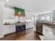 Modern kitchen with stainless steel appliances and dark hardwood floors at 278 Corona Cir, Mooresville, NC 28117