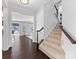 View of a staircase leading upstairs with dark hardwood floors at 278 Corona Cir, Mooresville, NC 28117