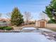 Backyard with shed and snow-covered patio at 3522 Larkhaven Village Dr, Charlotte, NC 28215