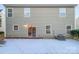 Backyard patio with snow on the ground and a view of the house at 3522 Larkhaven Village Dr, Charlotte, NC 28215