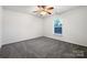 Bright bedroom with neutral carpeting and a ceiling fan at 3522 Larkhaven Village Dr, Charlotte, NC 28215