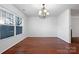 Bright dining room with hardwood floors and chandelier at 3522 Larkhaven Village Dr, Charlotte, NC 28215