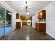 Kitchen with wood cabinets, white appliances, and a tiled floor at 3522 Larkhaven Village Dr, Charlotte, NC 28215
