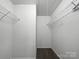 Large walk-in closet with double hanging rods and shelving at 3522 Larkhaven Village Dr, Charlotte, NC 28215