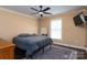 Bedroom with a queen-size bed, ceiling fan, and hardwood floors at 395 Paulownia Dr, China Grove, NC 28023