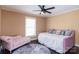 Bedroom with daybed and sitting area, ceiling fan, and hardwood floors at 395 Paulownia Dr, China Grove, NC 28023