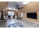 Multipurpose bonus room with home gym equipment, desk, and large TV at 395 Paulownia Dr, China Grove, NC 28023