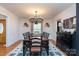 Elegant dining room with large chandelier and hardwood floors at 395 Paulownia Dr, China Grove, NC 28023