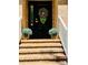 Inviting front entrance with brick steps, potted plants, and a decorative wreath on the door at 395 Paulownia Dr, China Grove, NC 28023