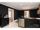 Modern kitchen with dark cabinets, geometric tile floor and island at 395 Paulownia Dr, China Grove, NC 28023