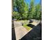 Outdoor patio area with a grill and furniture, perfect for relaxing and entertaining guests at 395 Paulownia Dr, China Grove, NC 28023