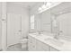 Bright bathroom with double vanity, shower, and toilet at 448 E 16Th St, Charlotte, NC 28206