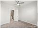 Bright bedroom with ceiling fan and neutral carpeting at 448 E 16Th St, Charlotte, NC 28206