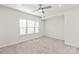 Bright bedroom with ceiling fan and window at 448 E 16Th St, Charlotte, NC 28206