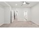 Spacious bedroom with ceiling fan and carpet at 448 E 16Th St, Charlotte, NC 28206