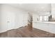 Hallway with hardwood floors, white doors and staircase at 448 E 16Th St, Charlotte, NC 28206
