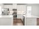 Modern kitchen with white cabinets, quartz counters and stainless steel appliances at 448 E 16Th St, Charlotte, NC 28206
