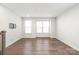 Bright living room with hardwood floors and large windows at 448 E 16Th St, Charlotte, NC 28206