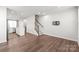 Spacious living room with hardwood floors and stairs at 448 E 16Th St, Charlotte, NC 28206