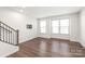 Bright living room with hardwood floors and large windows at 448 E 16Th St, Charlotte, NC 28206