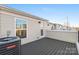 Enjoy outdoor living on the spacious roof deck with sleek gray flooring, and city views at 448 E 16Th St, Charlotte, NC 28206