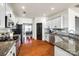 Modern kitchen with stainless steel appliances and granite countertops at 4897 Annelise Dr, Harrisburg, NC 28075