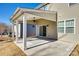 Covered patio with ceiling fan, perfect for relaxing at 4897 Annelise Dr, Harrisburg, NC 28075