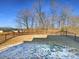 Fenced backyard with a mix of grass and bare ground at 6848 Good News Dr, Charlotte, NC 28215